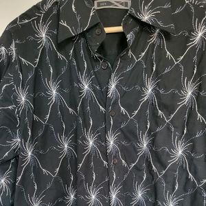 Men's stylish shirt, size is medium but may fit a slightly large person.